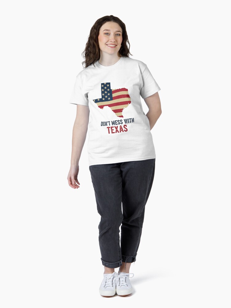 “Distressed Texas state outline t-shirt with rustic American flag and bold ‘Don’t Mess With Texas’ text – retro patriotic design”