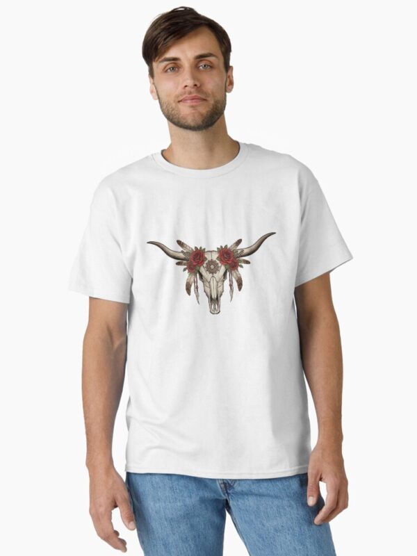 “Longhorn cow skull with feathers and roses in boho western style on rustic t-shirt – country girl aesthetic shirt design”