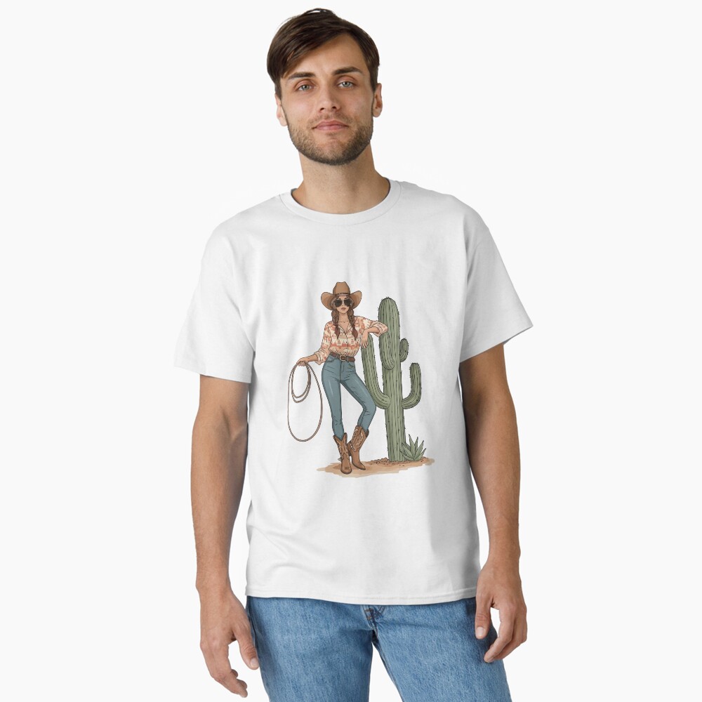 “Boho cowgirl t-shirt with cactus, hat, boots, and floral western design – feminine rodeo style”